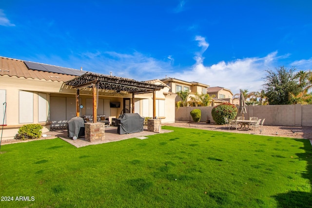 back of house featuring a yard and a patio area