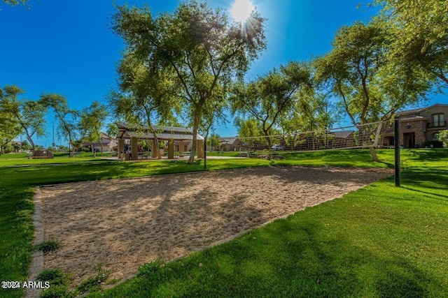 view of community featuring a yard and volleyball court