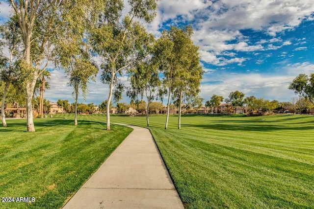 surrounding community featuring a lawn