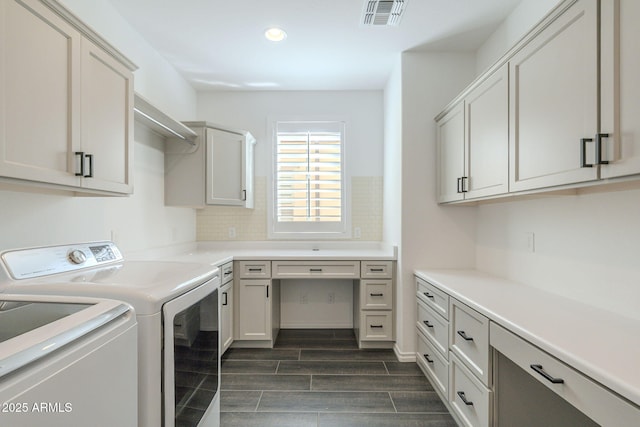 washroom with cabinets and independent washer and dryer