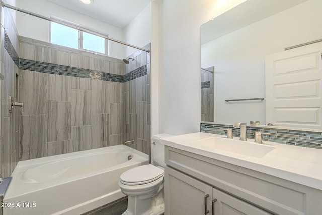 full bathroom featuring vanity, shower / tub combination, tasteful backsplash, and toilet