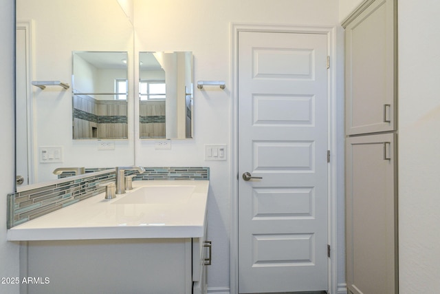 bathroom featuring backsplash and vanity