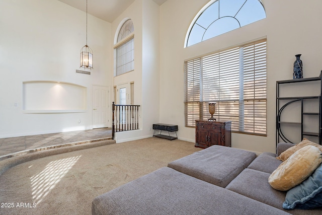 12925 W Llano Dr, Litchfield Park, AZ 85340 - bedroom featuring carpet floors, a high ceiling, multiple windows, and baseboards