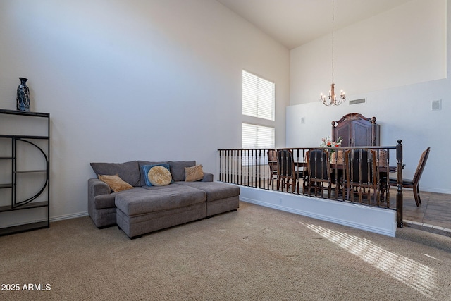 12925 W Llano Dr, Litchfield Park, AZ 85340 - living room featuring high vaulted ceiling, carpet, visible vents, and a chandelier