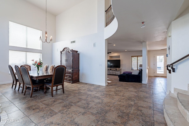 12925 W Llano Dr, Litchfield Park, AZ 85340 - dining space featuring stairs, baseboards, visible vents, and an inviting chandelier