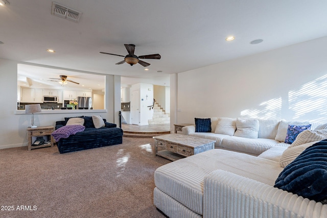 12925 W Llano Dr, Litchfield Park, AZ 85340 - living room featuring ceiling fan, recessed lighting, visible vents, baseboards, and stairway