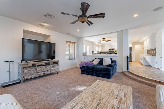 12925 W Llano Dr, Litchfield Park, AZ 85340 - living room featuring visible vents, baseboards, light colored carpet, ceiling fan, and recessed lighting