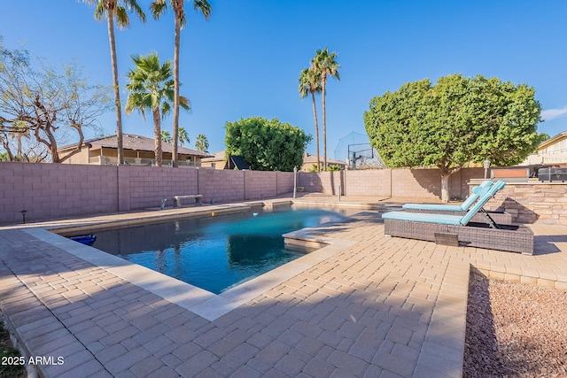 12925 W Llano Dr, Litchfield Park, AZ 85340 - view of swimming pool featuring a hot tub, a fenced backyard, a fenced in pool, and a patio