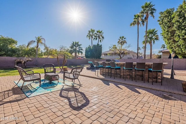 12925 W Llano Dr, Litchfield Park, AZ 85340 - view of patio / terrace with outdoor dry bar and a fenced backyard