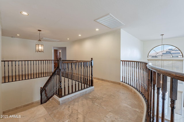 12925 W Llano Dr, Litchfield Park, AZ 85340 - hall featuring recessed lighting, visible vents, an upstairs landing, a chandelier, and baseboards