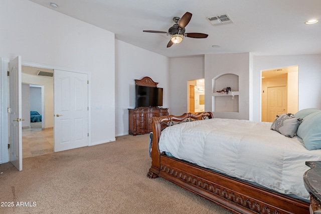 12925 W Llano Dr, Litchfield Park, AZ 85340 - bedroom featuring light carpet, lofted ceiling, visible vents, and a ceiling fan