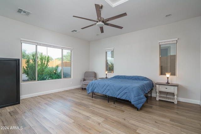 bedroom featuring light hardwood / wood-style floors and ceiling fan