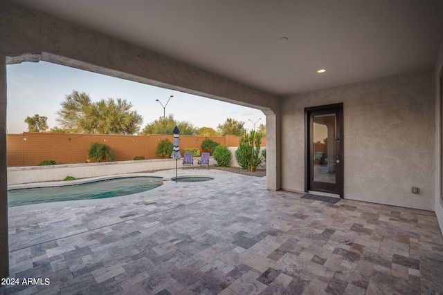 view of swimming pool featuring a patio area