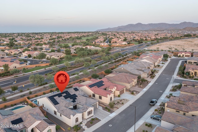 birds eye view of property featuring a mountain view