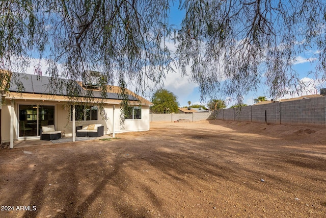 rear view of house with a patio