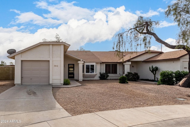 ranch-style house featuring a garage