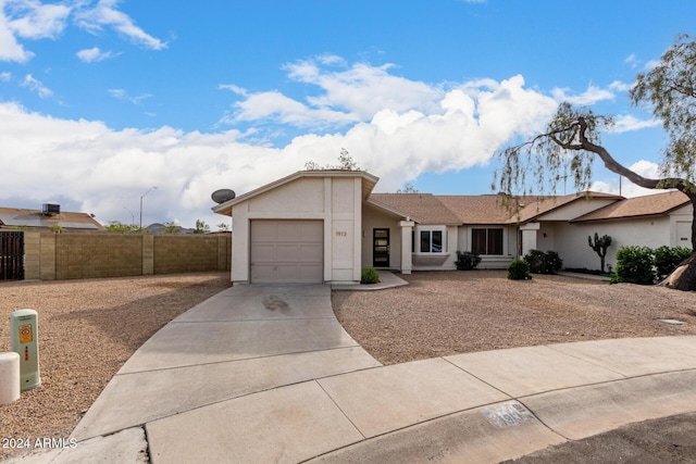 single story home featuring a garage