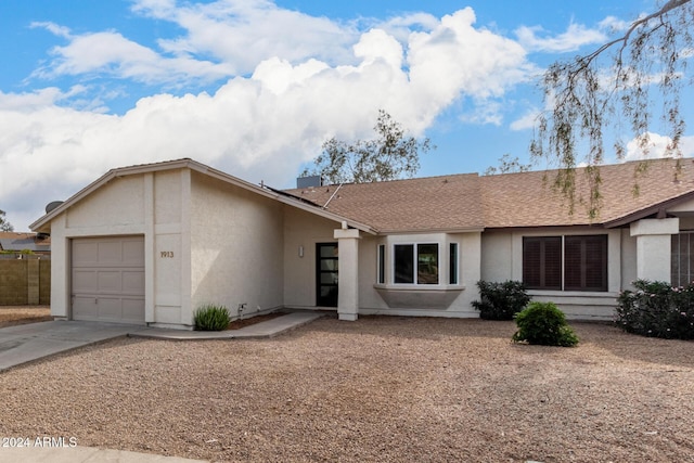 ranch-style home with a garage