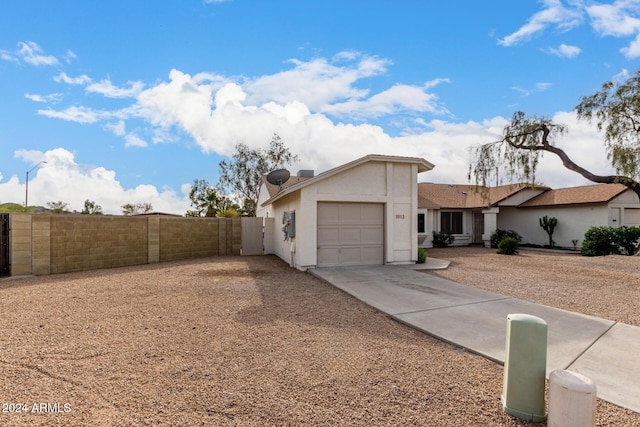 ranch-style house featuring a garage