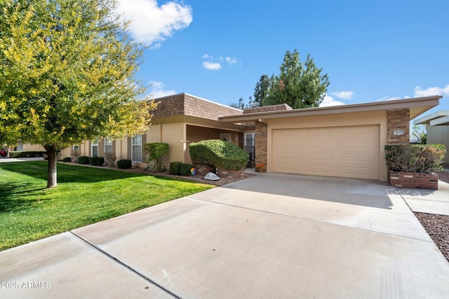 view of front of home with a garage and a front yard