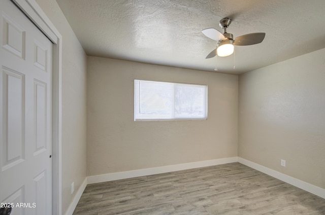 3408 W Virginia Ave, Phoenix, AZ 85009 - empty room featuring wood finished floors, a textured ceiling, baseboards, and a ceiling fan