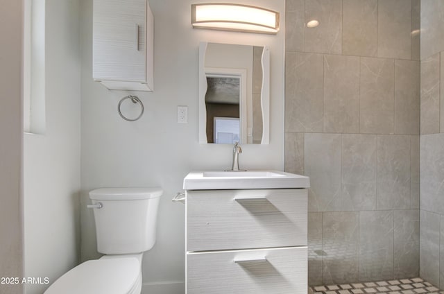 3408 W Virginia Ave, Phoenix, AZ 85009 - bathroom with toilet, vanity, and a tile shower
