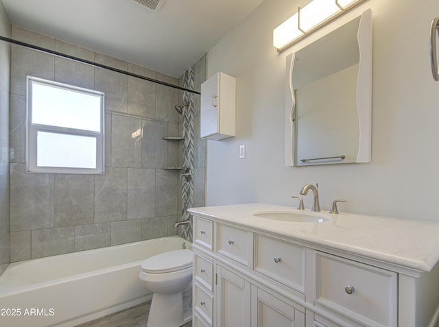 3408 W Virginia Ave, Phoenix, AZ 85009 - bathroom featuring vanity, tub / shower combination, and toilet