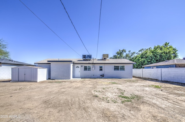 3408 W Virginia Ave, Phoenix, AZ 85009 - rear view of house featuring brick siding and central air condition unit