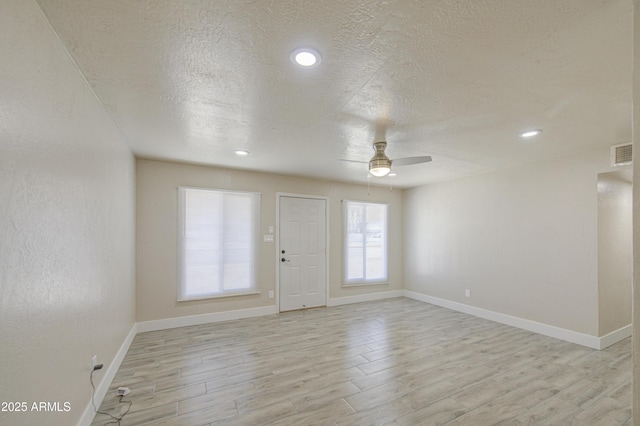 3408 W Virginia Ave, Phoenix, AZ 85009 - entrance foyer with a ceiling fan, light wood-type flooring, a textured ceiling, baseboards, and recessed lighting