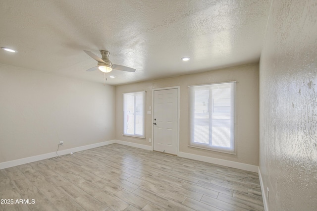 3408 W Virginia Ave, Phoenix, AZ 85009 - foyer entrance featuring light wood-style flooring, ceiling fan, a textured ceiling, baseboards, and recessed lighting