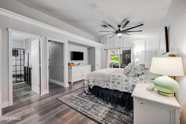 13207 N 55th Ave, Glendale, AZ 85304 - bedroom with a textured ceiling, dark wood-style flooring, and ceiling fan