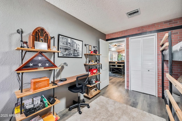 13207 N 55th Ave, Glendale, AZ 85304 - home office with wood finished floors and a textured ceiling