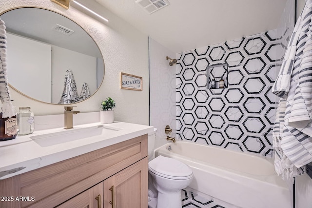full bath featuring visible vents, toilet, shower / bath combination, and vanity