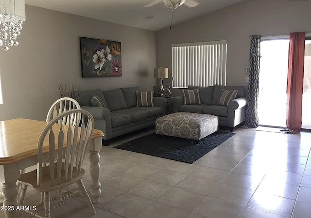 30178 N Coral Bean Dr, San Tan Valley, AZ 85143 - living room with lofted ceiling, light tile patterned flooring, a ceiling fan, and a chandelier