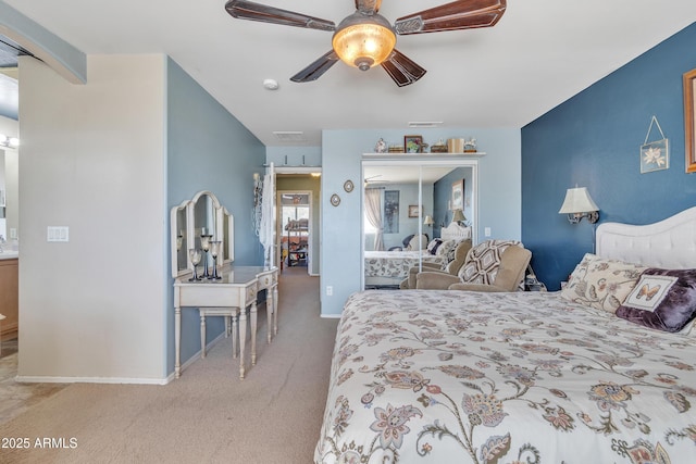 bedroom featuring visible vents, baseboards, ceiling fan, carpet floors, and a closet