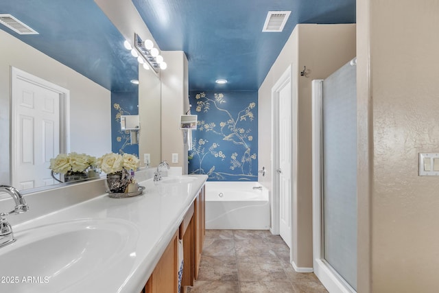 full bath with a garden tub, visible vents, and a sink