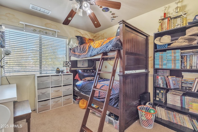 carpeted bedroom featuring visible vents