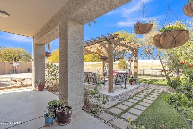 view of patio / terrace with a fenced backyard and a pergola