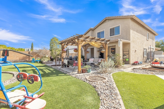 rear view of property with a yard, stucco siding, a patio area, fence, and a pergola