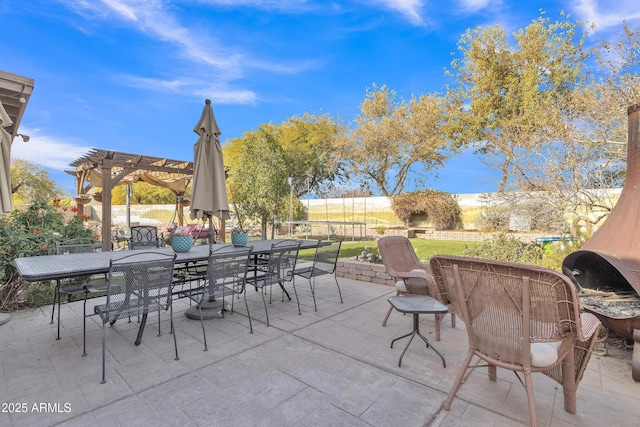 view of patio / terrace featuring outdoor dining area and a pergola