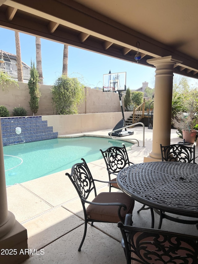 view of swimming pool featuring a patio, a fenced backyard, and a fenced in pool