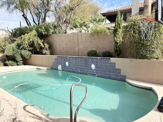 view of pool with fence and a fenced in pool