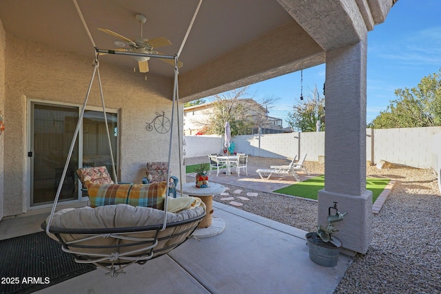 view of patio / terrace featuring ceiling fan, outdoor dining area, and a fenced backyard