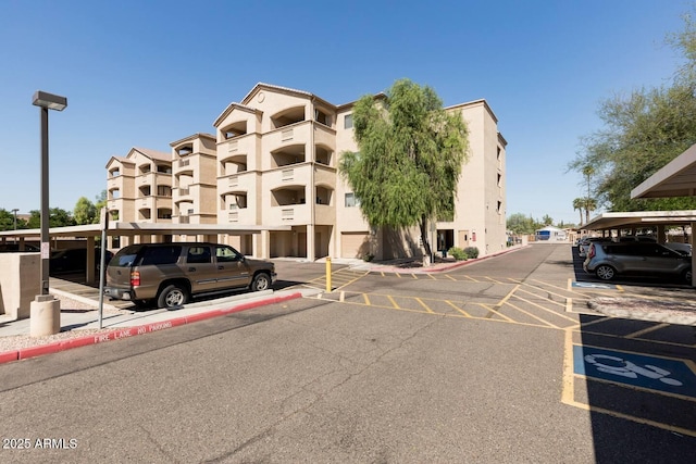 920 E Devonshire Ave Unit 2031, Phoenix, AZ 85014 - view of building exterior featuring covered and uncovered parking