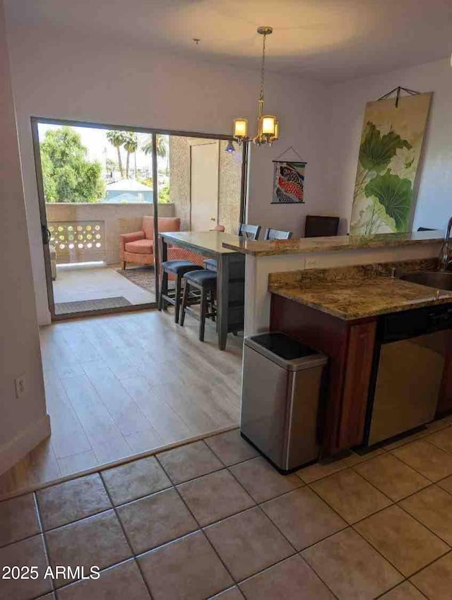 920 E Devonshire Ave Unit 2031, Phoenix, AZ 85014 - kitchen with dishwasher, a chandelier, decorative light fixtures, and light tile patterned floors