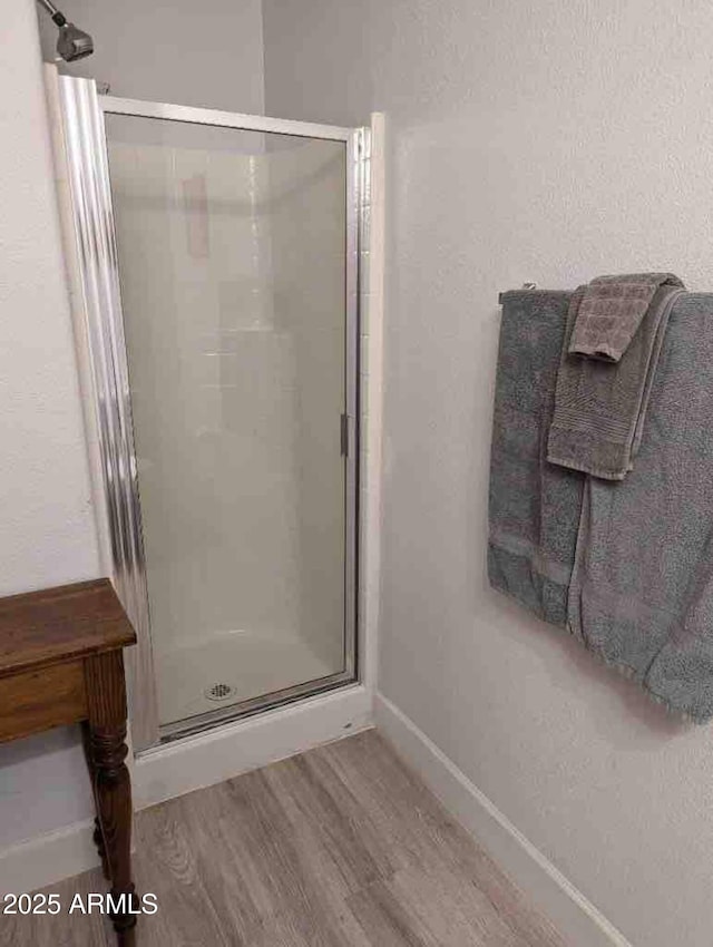 920 E Devonshire Ave Unit 2031, Phoenix, AZ 85014 - bathroom featuring a shower stall and wood finished floors