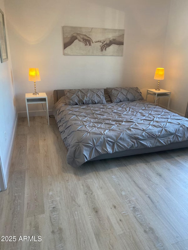 920 E Devonshire Ave Unit 2031, Phoenix, AZ 85014 - bedroom with wood finished floors and baseboards