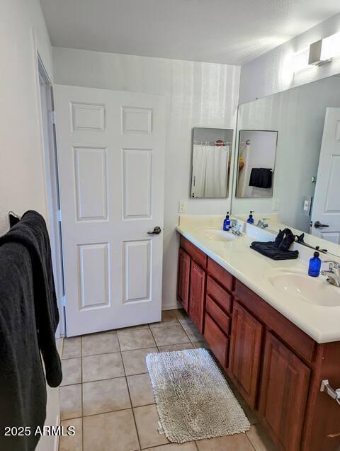 920 E Devonshire Ave Unit 2031, Phoenix, AZ 85014 - full bathroom featuring tile patterned floors and double vanity