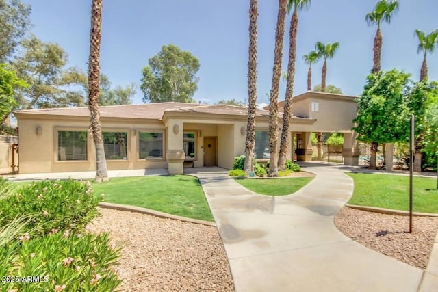 920 E Devonshire Ave Unit 2031, Phoenix, AZ 85014 - view of front of house featuring stucco siding and a front lawn