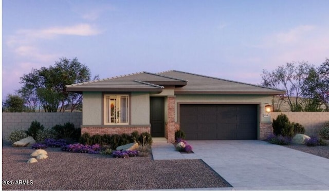 view of front of home with a garage, brick siding, concrete driveway, and fence